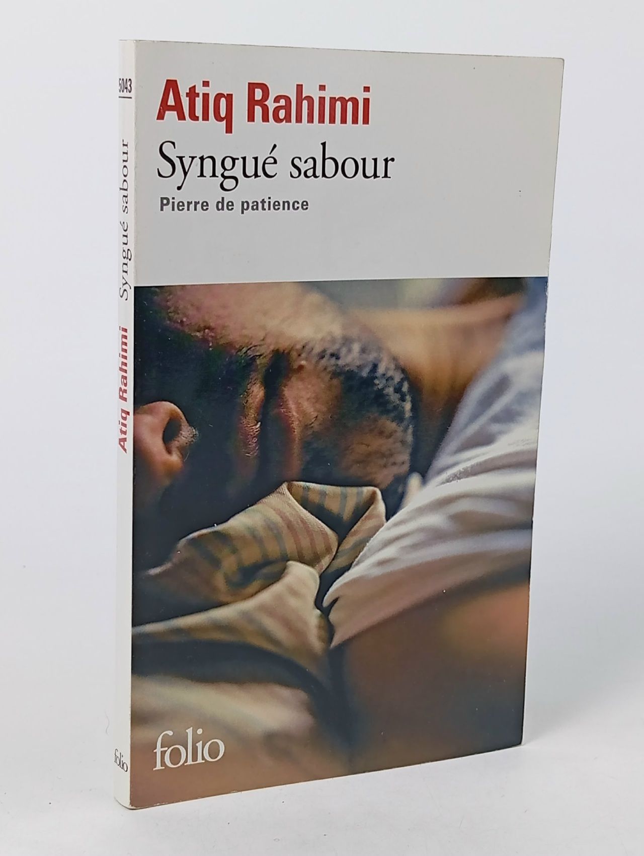 Обложка: Synguе sabour. Pierre de patience